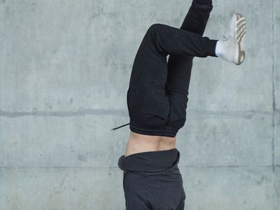 Shadow of a man performing dynamic bodyweight movements